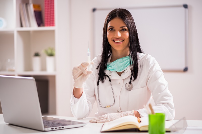 doctor holding a vaccine to protect website again accessibility lawsuit