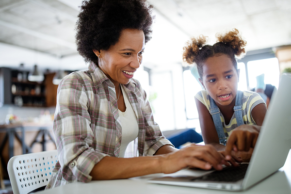 parent and student looking at school website