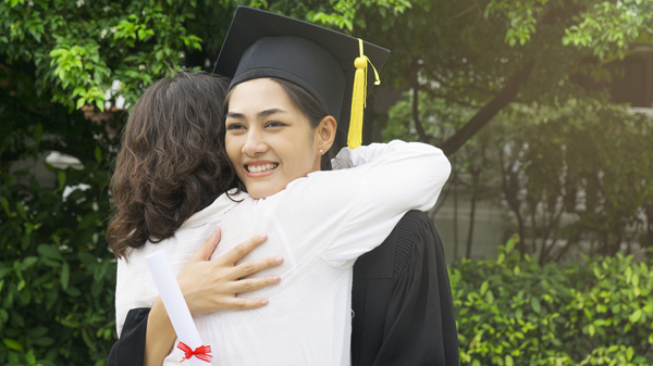 engaged parent with high school graduate