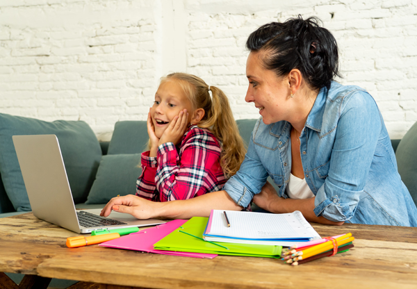 Mother helping daughter with homework