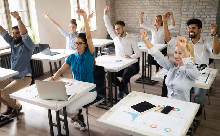 Adults in classroom excited to learn about accessibility