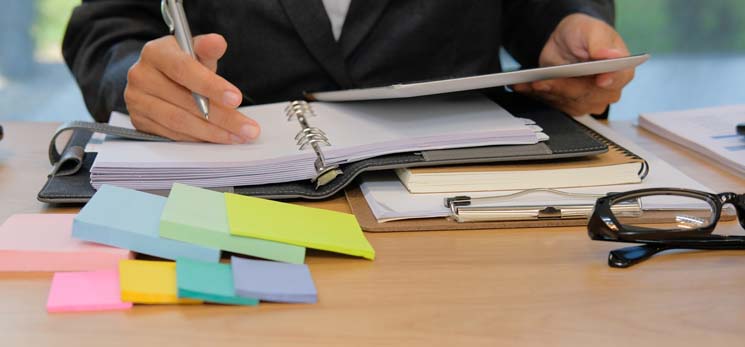 person sitting at desk getting organized