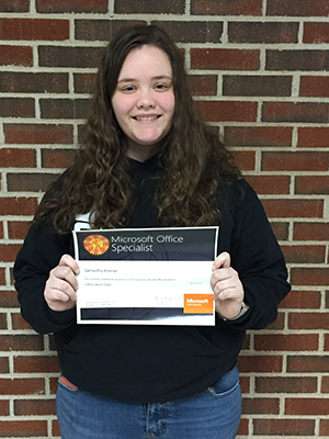 Samantha Kermer holding her certificate