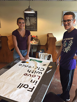 Parker Stout and Toby Hollis working on Clarence Mainstreet banners.