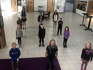 Students social distancing for a fun picture to celebrate classroom of the week