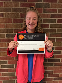 Alyssa Barnhart holds up her certificate for passing the Microsoft Office 2016 Word Specialist exam