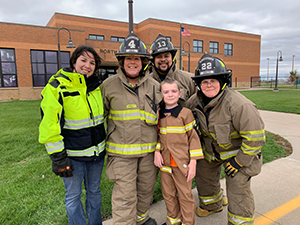 Firefighters and student