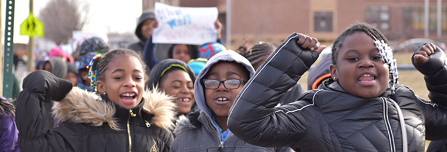 Students cheering at a rally
