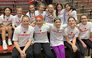 Women's volleyball team members pose together