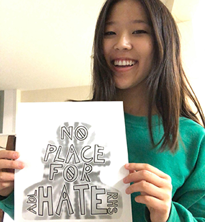 Student holdin No Place For Hate picture