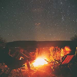 Campfire under a starry sky