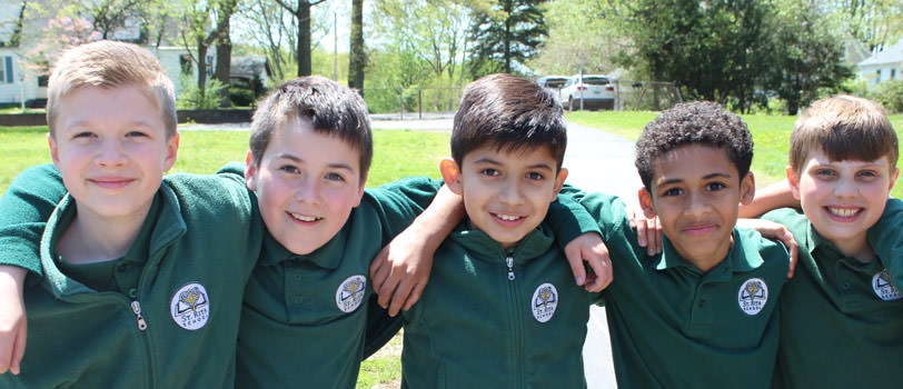 Five students with their arms linked together
