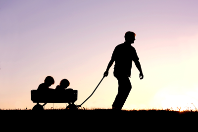 What Matters Most photo of silhouette of father pulling a wagon
