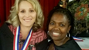 Teacher of the Year, Kelly Zamudio posing for a picture with a friend