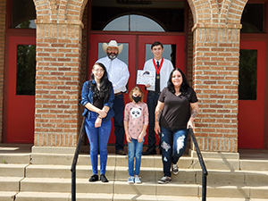 Eighth grade graduate Billy Dorsey with his family