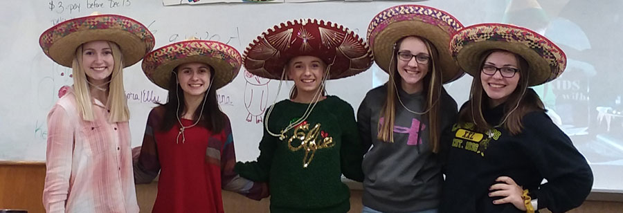 five students wearing sombreros