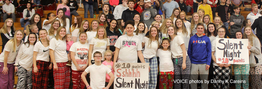 Students pose together in a gym