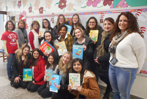 Group of students and teachers holding Dr. Seuss books