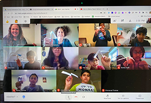 Teachers and students showing off straw rockets during virtual meeting