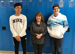Band members pose together with staff