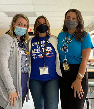 Three teachers wearing blue shirts during Week of Respect