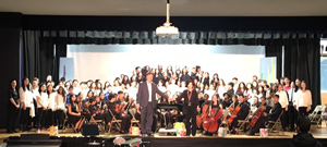 Orchestra standing on stage