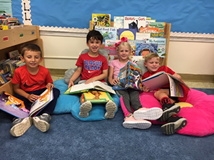 Students reading with pillows
