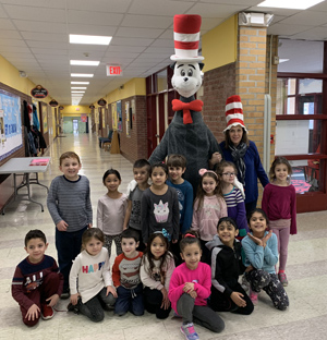 Students posing with The Cat In The Hat character