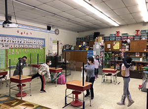 first graders celebrating snow in classroom