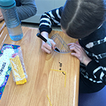 Student uses a ruler to make and measure angles