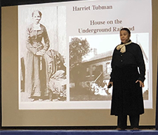 An adult presents a presentation on Harriet Tubman