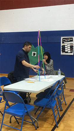 A parent and a student design a structure together