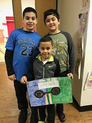 students showing off their 100th day barbell