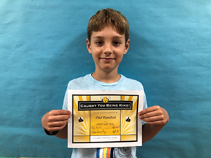 students holding his award