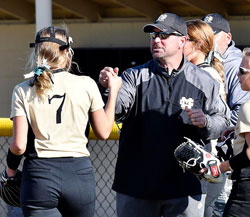 Madison-Grant's pitcher Elizabeth Lee gets a fist bump from head coach Travis Havens
