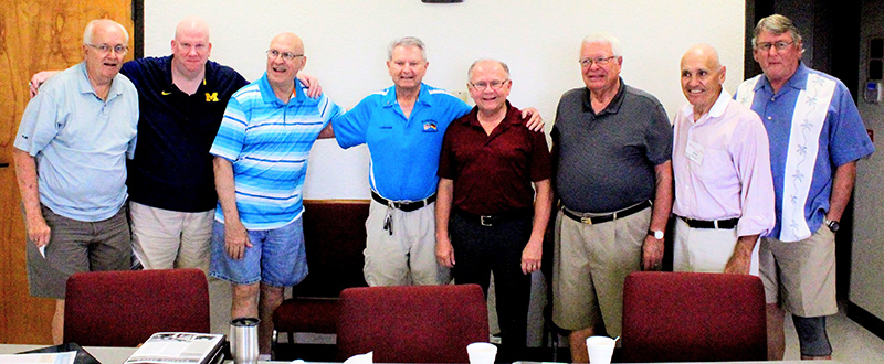 8 men smiling