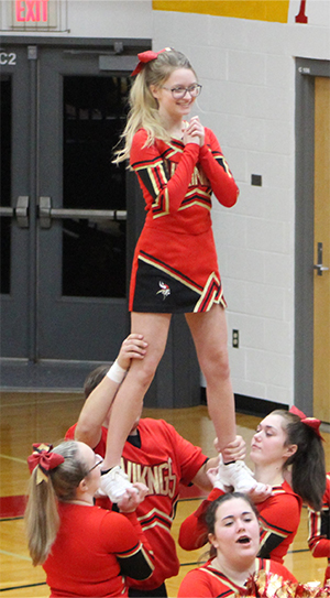 Peyton Watson with her cheerleading team