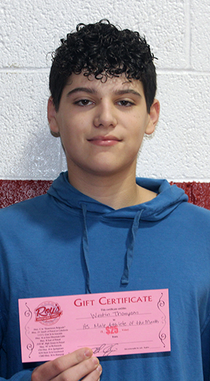 Westin Thompson holding up a certificate