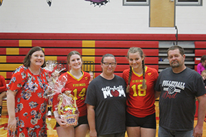 Senior volleyball athletes with their families