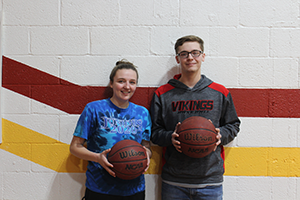 Liz Morris and Skylar DeClue pose with basketballs