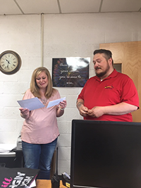 Mrs. Jones accepts her award as an administrator stands by