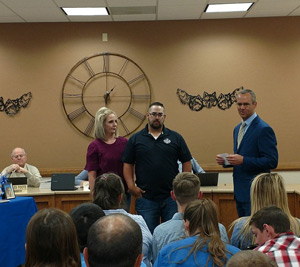 Kendall and Molli Bryant receiving appreciation from board