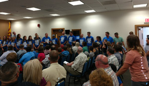 female track team and coaches being recognized for success