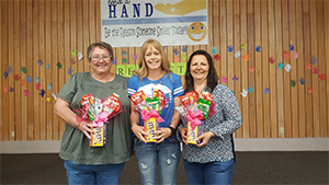 Office ladies and principal Ms. Debbie Muder pose with their gifts