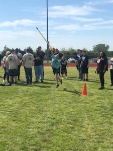 Special olympic athlete throwing javelin