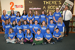 K-Kids pose together with a teacher