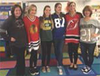 Six women pose together