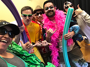 staff members wearing sunglasses and beach attire