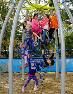 Students playing on the new playground equipment