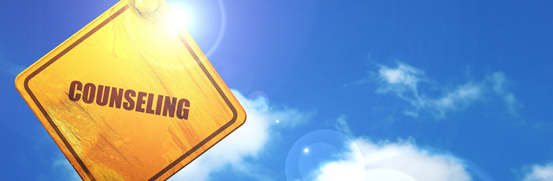blue sky with clouds with a yellow street sign that says Counseling